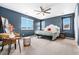 Stylish primary bedroom with a ceiling fan and ample natural light at 18077 E 99Th Ave, Commerce City, CO 80022