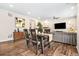 Open-concept dining room with modern furniture and a view of the living area at 18077 E 99Th Ave, Commerce City, CO 80022