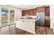Modern kitchen featuring granite countertops, stainless steel appliances, and a center island with seating at 18077 E 99Th Ave, Commerce City, CO 80022