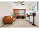 Inviting living room with neutral carpet, stylish furniture, and natural light from the large window at 18077 E 99Th Ave, Commerce City, CO 80022