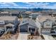 Aerial view of a charming home in a well-planned community with mountain views and manicured landscapes at 8517 Eckley St, Littleton, CO 80125