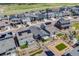 An elevated view captures modern homes, solar panels, and beautifully landscaped yards in a suburban neighborhood setting at 8517 Eckley St, Littleton, CO 80125