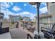 The cozy back deck includes a grill, seating, and a heating tower for entertaining in the cool weather at 8517 Eckley St, Littleton, CO 80125