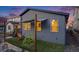 A backyard view features a modern playset, privacy shade, and a low maintenance landscape at 8517 Eckley St, Littleton, CO 80125