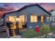 Enjoy outdoor living in this backyard with a deck, seating, grill, playset, shade sail and a nicely landscaped yard at 8517 Eckley St, Littleton, CO 80125