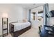 Cozy bedroom featuring natural light, a daybed with storage, and a desk space at 8517 Eckley St, Littleton, CO 80125