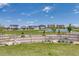 A charming community park features a basketball court, a well-maintained fence, and lush greenery at 8517 Eckley St, Littleton, CO 80125