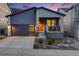 Charming single-Gathering home boasts a modern design, landscaping, and a welcoming orange front door at 8517 Eckley St, Littleton, CO 80125
