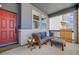 Inviting front porch with comfortable seating, perfect for relaxing and enjoying the outdoors at 8517 Eckley St, Littleton, CO 80125