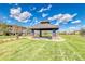 Community gazebo with seating, lawn, and walking path at 9585 Pearl Cir # 203, Parker, CO 80134