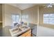 Bright kitchen boasts stainless steel sink, black dishwasher, and large adjacent living area at 9585 Pearl Cir # 203, Parker, CO 80134