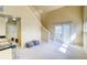 A spacious living room with modern furniture and a sliding glass door at 9585 Pearl Cir # 203, Parker, CO 80134