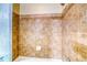 Tiled shower with neutral tones and shower head at 9585 Pearl Cir # 203, Parker, CO 80134