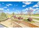 Nice view from second story porch, with brick retaining wall and garden in the foreground at 9585 Pearl Cir # 203, Parker, CO 80134