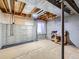 Unfinished basement with exposed ceiling and concrete walls, offering potential for customization at 5155 W Quincy Ave # J103, Denver, CO 80236