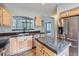 Kitchen featuring granite countertops, stainless steel appliances, and ample cabinet space at 5155 W Quincy Ave # J103, Denver, CO 80236