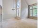 Light-filled living space with soaring ceilings and many windows at 5155 W Quincy Ave # J103, Denver, CO 80236