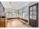 Bright living room featuring large windows, hardwood floors, and stylish lighting at 30690 Highway 72, Golden, CO 80403