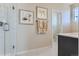 Modern bathroom with walk-in shower featuring white tile, and a dark wood vanity with white countertop at 14127 Deertrack Ln, Parker, CO 80134