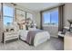 Bright bedroom showcasing a large window, plush carpet, and elegant decor at 14127 Deertrack Ln, Parker, CO 80134