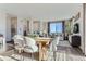 Bright dining area with contemporary furnishings, seamlessly connected to a cozy living room and sunlit windows at 14127 Deertrack Ln, Parker, CO 80134