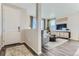 The well-lit living room has modern furnishings and hardwood floors, featuring a decorative rug and television at 14127 Deertrack Ln, Parker, CO 80134