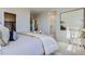 Spacious main bedroom with en-suite bathroom features a walk-in closet and bright natural light at 14127 Deertrack Ln, Parker, CO 80134
