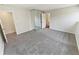 Spacious bedroom with grey carpet and mirrored closet doors at 2354 S Troy St, Aurora, CO 80014