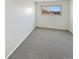 Well-lit bedroom with grey carpet and a window at 2354 S Troy St, Aurora, CO 80014