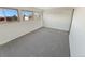 Bright bedroom with grey carpet and large windows offering an outdoor view at 2354 S Troy St, Aurora, CO 80014