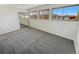 Spacious bedroom with mirrored closet and multiple windows at 2354 S Troy St, Aurora, CO 80014