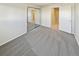 Spacious bedroom with grey carpet and access to hallway at 2354 S Troy St, Aurora, CO 80014