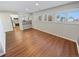 Open dining room with hardwood floors and kitchen views at 2354 S Troy St, Aurora, CO 80014