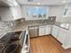 Updated kitchen, featuring granite countertops and stainless steel appliances at 2354 S Troy St, Aurora, CO 80014