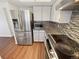 Modern kitchen with stainless steel appliances and granite countertops at 2354 S Troy St, Aurora, CO 80014
