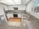 Modern kitchen with white cabinets, granite counters, and stainless steel appliances at 2354 S Troy St, Aurora, CO 80014