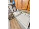 Bright laundry room, featuring a washer and dryer, and ample storage at 2354 S Troy St, Aurora, CO 80014
