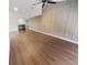 Open living room with hardwood floors, a fireplace, and ceiling fan at 2354 S Troy St, Aurora, CO 80014
