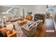 Virtually staged living room features a fireplace and hardwood floors at 2354 S Troy St, Aurora, CO 80014