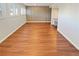 Spacious living area featuring wood-look floors and modern wall accents at 2354 S Troy St, Aurora, CO 80014
