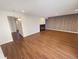 Bright living room with wood-look floors, a fireplace, and access to a patio at 2354 S Troy St, Aurora, CO 80014