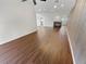 Living room with hardwood floors, fireplace, and view into another room at 2354 S Troy St, Aurora, CO 80014
