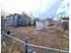 Expansive backyard with potential for landscaping, featuring a shed and a backdrop of neighboring homes at 914 La Farge Ave, Louisville, CO 80027
