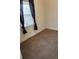 Small bedroom featuring a window with brown carpet at 914 La Farge Ave, Louisville, CO 80027