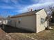 Side view of home showing siding, windows, roofline, and ladder resting against the building at 914 La Farge Ave, Louisville, CO 80027