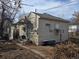 Side view of home with exterior features, including a small patio and vintage bath tub at 914 La Farge Ave, Louisville, CO 80027