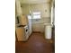 White kitchen with vintage appliances, cabinets and laminate flooring at 914 La Farge Ave, Louisville, CO 80027