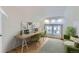 Attic room with work space, lounge area, sloped ceiling, and natural light at 1474 Clayton St, Denver, CO 80206