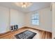 Bright bedroom with hardwood floors, white walls, and natural light from a window at 1474 Clayton St, Denver, CO 80206