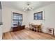 Dining room featuring hardwood floors and windows offering plenty of natural light at 1474 Clayton St, Denver, CO 80206